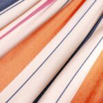 Houpací síť s tyčemi CHILLOUNGE® Single - sunrise detail látky