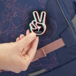 Jedna placka na suchý zip je součástí batohu je vyměnitelná.